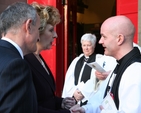 The Revd David Gillespie, Vicar of St Ann's greets Mary McAleese, President of Ireland and her husband, Dr Martin McAleese at the Service of Commemoration and Thanksgiving to mark ANZAC Day. In the background is the Revd Canon Katharine Poulton who was Chaplain to the President during the service.