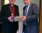 Presentation to Archbishop John Neill by Denis Reardon on behalf of Church of Ireland House. Photo: David Wynne.