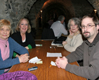 Valerie Jones, Glynas Allison, Hilary McCrae and Claire Hudson get ready to pit their wits against the other teams in the Crypt table quiz in Christ Church Cathedral. 