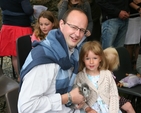 Michael Hamilton and his daughter and 'Nugget' at the Blessing of the Pets Service in Ballinatone, Co Wicklow.