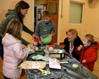 Participants get messy icing buns at a Palm Sunday themed Messy Church in Wicklow. 