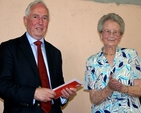 Dean Stacey receives a travel voucher from his former parishioners presented by Betty McKee (photo: Chris Henderson)