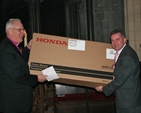Diocesan Secretary Scott Hayes presenting Archbishop Neill with the gift of a lawn mower at a special presentation ceremony in Christ Church Cathedral following the Eucharist to mark his retirement as Archbishop of Dublin and Glendalough.