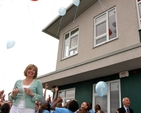 There is huge excitement as the children let go their balloons at the official opening and blessing of Athy Model School. School principal, Yvonne Griffin, joins in the fun.