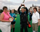 The captain of the victorious Dalkey team raises the cup following the Diocesan Inter–Parish Hockey Tournament which took place in St Andrew’s College, Booterstown. Also pictured are organisers, Revd Gillian Wharton and Revd Anne Taylor.