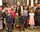 Children who took part in the International Carol Service in St George and St Thomas’s are pictured with Archbishop Michael Jackson, the Revd Obinna Ulogwara and Gillian Dean. 