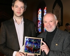 David Bremner receiving an award for his work as organist at Sandford Parish. Also pictured is George Walsh, designer of the award. Photo: David Wynne