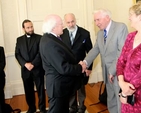 Dr Kenneth Milne is welcomed by President Michael D Higgins during the visit of Cumann Gaelach na hEaglaise to Áras an Uachtaráin. 