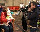 One of the Peata dogs is interviewed by Sharon Gaffney of RTE at the Peata Carol Service in Christ Church Cathedral. 