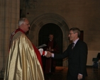 Archbishop John Neill presenting Tom Healy with a certificate for completing the Archbishop's Certificate Course in Theology. 