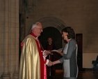 Archbishop John Neill presenting Heather Waugh with a certificate for completing the Archbishop's Certificate Course in Theology. 