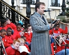 Spirit Radio’s Ronan Johnson delivers a reading at the Community Carol Singing outside the Mansion House on Saturday December 15.