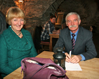 Celia Dunne and Ted Shine prepare their strategy before the Crypt table quiz in Christ Church Cathedral. 