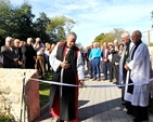 Archbishop Michael Jackson cuts the ribbon following the dedication and official opening of The Stables at Whitechurch Parish which have been reconstructed and extended. 