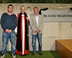 Simon and John Nelson, son and husband of the late Dr Linda Nelson, with Archbishop Michael Jackson following the dedication of the new hockey pitch at East Glendalough School.