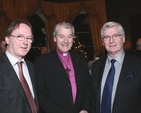 The Most Revd Dr Michael Jackson, archbishop of Dublin & Glendalough with Michael and Philip Sheppard at the launch of the Christ Church auction catalogue in the Shelbourne Hotel on Monday 12 December 2011.