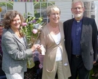 Rector’s churchwarden at St Patrick’s Church, Dalkey, Carolyn Peare, presenting Kay Neill with flowers at a special picnic to mark Canon Ben Neill’s retirement. 