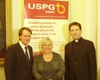 Pictured at the launch of the photographic exhibition 'Living Positively with HIV/AIDS' in the Gallery Chapel, Trinity College Dublin, were Peter Power TD, Minister of State for Overseas Development; Linda Chambers, Director of USPG Ireland; and the Revd Darren McCallig, Dean of Residence at TCD. Photo: Trinity Chaplaincy. 