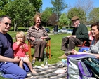 Malcolm and Jean Duff from Powerscourt and Paul and Suzi Dixon and their daughter from Wicklow enjoy their picnic at the Glendalough Family Fun Day, organised by 3Rock Youth, in East Glendalough School, Wicklow, on May 19.