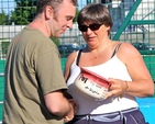 The Revd Rob Clements, Rathfarnham team manager, is presented with the Archbishop’s chamber pot by the Revd Gillian Wharton having come last in Diocesan Inter Parish Hockey Tournament in St Andrew’s College, Dublin, on June 9.