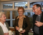 Pictured at the Brabazon House Carol Service are (left to right) Joan Mahony, Elsie Nelson and the Revd Harry Lew (Chaplain to the House).