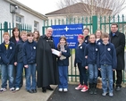 Sixth class students from Castleknock NS presenting the Revd David Gillespie, Vicar at St Ann's, with a cheque for €1,087 for the Black Santa sit-out appeal. Also pictured are Sandra Moloney, principal, and the Revd Victor Fitzpatrick, curate of Castleknock and Mulhuddart with Clonsilla. 