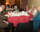 A group of people enjoying themselves at Rathmichael’s Edwardian tea party to celebrate Nollag na mBan.