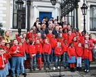 Organisers and readers at the Community Carol Singing at the Mansion House Dublin gather on the steps with the choir of St Ultan’s School, Cherry Orchard and the Cherry Orchard Community Singers. The readers included the Lord Mayor of Dublin, Naoise Ó Muirí, Paddy Moloney of the Chieftans, Ronan Johnson of Spirit Radio and Diocesan President of the Mothers’ Union Joy Gordon. Also pictured are the Revd Ken Rue, Geoffrey McMaster and Gerard Gallagher of the organising committee. 