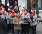 RTE’s David Davin Power reading at the Community Carol Singing on the steps of the Mansion House. 