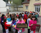 The pupils from Powerscourt National School lined up and prepared to leave the old schoolhouse in Enniskerry for the last time. The schoolhouse had been in continuous use since 1918 and the children carried items from their old school to the new building – which is one of only two passive schools in the country. 