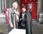 The Very Revd Cecil Faull, former Dean of Leighlin (left) lending moral support to the Revd David Gillespie, Vicar of St Ann's (aka Black Santa) as he resumes his sit out in aid of the Haiti Earthquake Appeal.