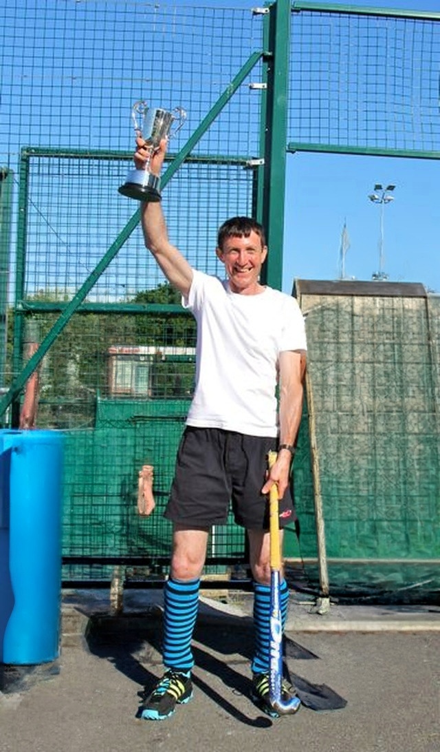 Graham Codd lifts the trophy on behalf of the victorious team from Newcastle and Newtownmountkennedy with Calary in 2013. (Please note that this image has been modified from the original taken in 2013)