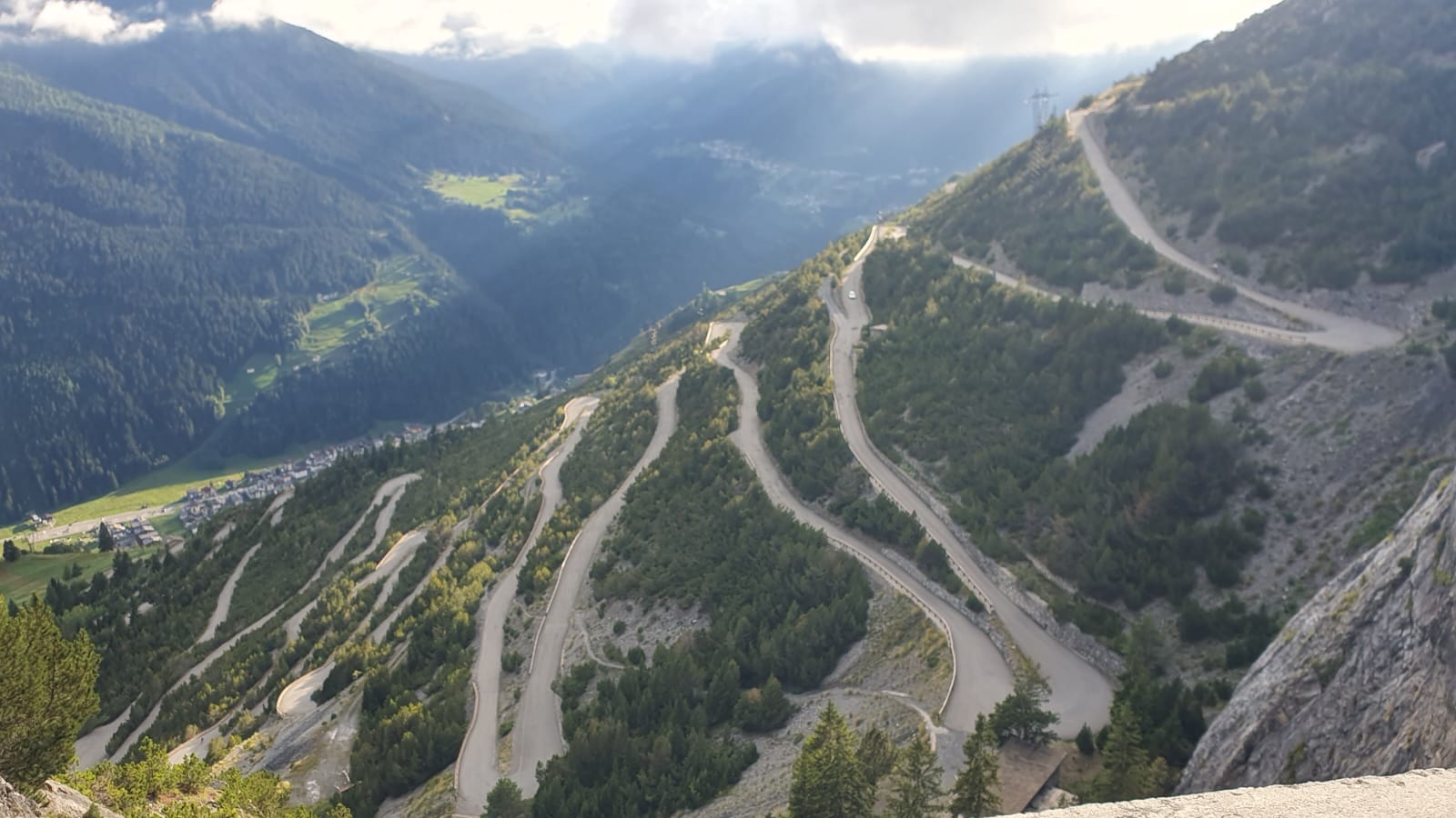 Sun breaks through clouds among the Italian Alps.  Photo credit: Jonathan Hull.