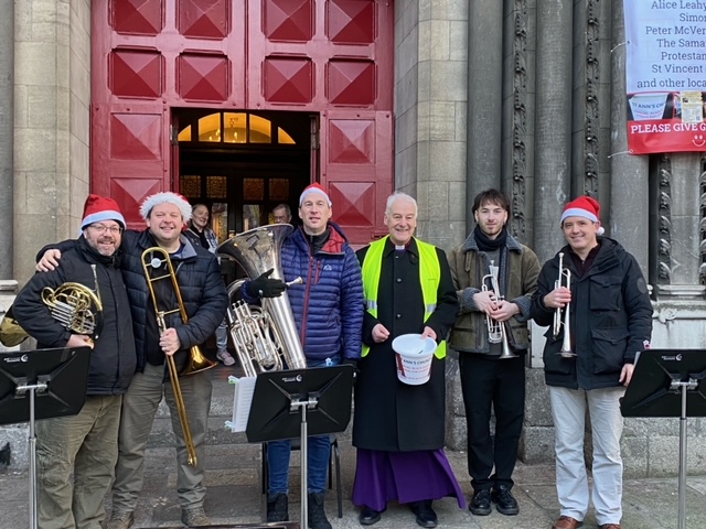 Archbishop Michael Jackson with members of the brass section of the RTE Concert Orchestra.