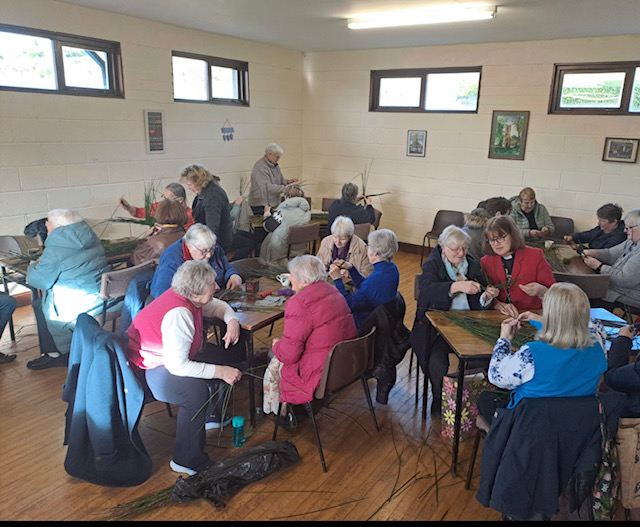 Making St Brigid's Crosses.