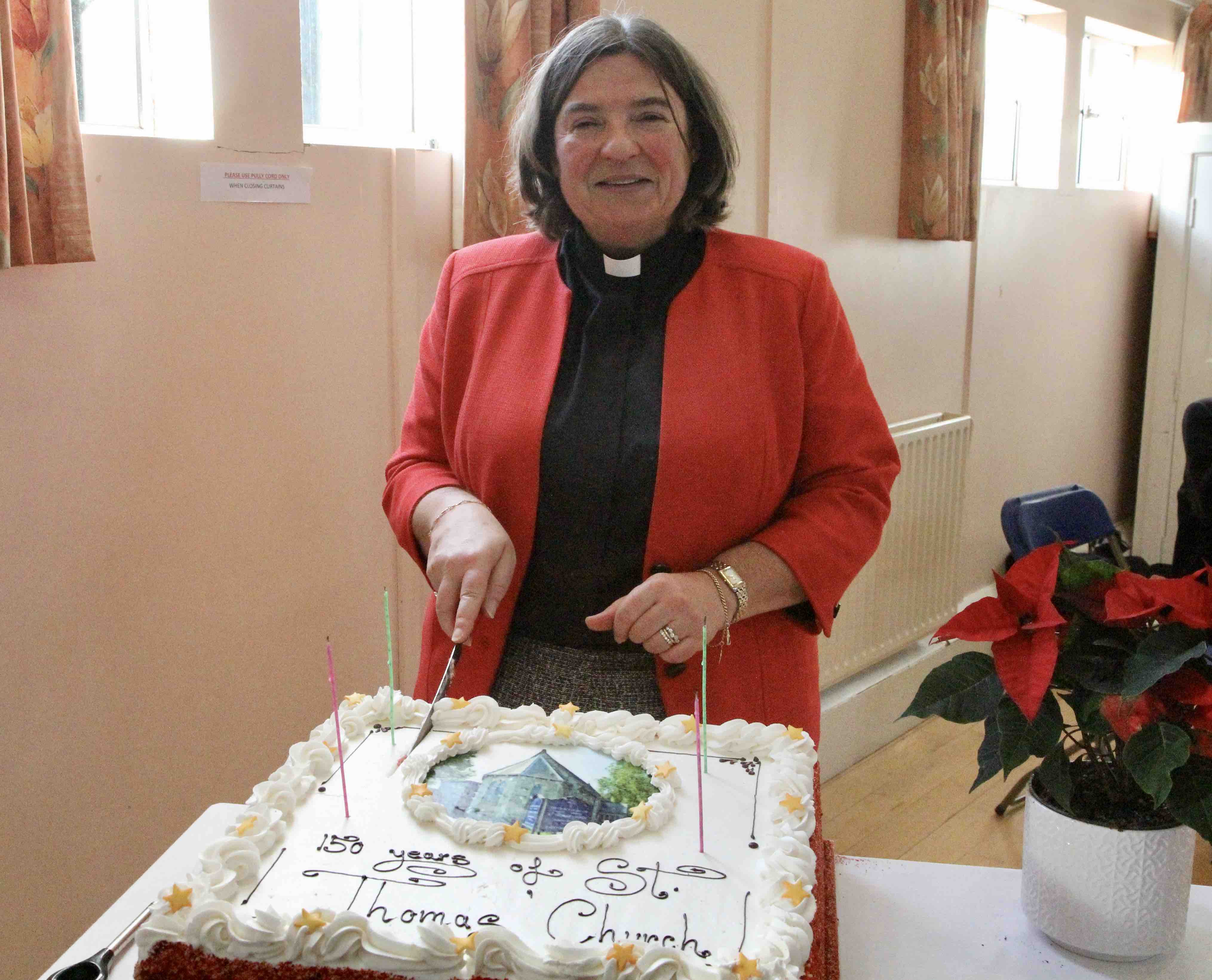 Celebrating with a special cake cut by Canon Gillian Wharton.