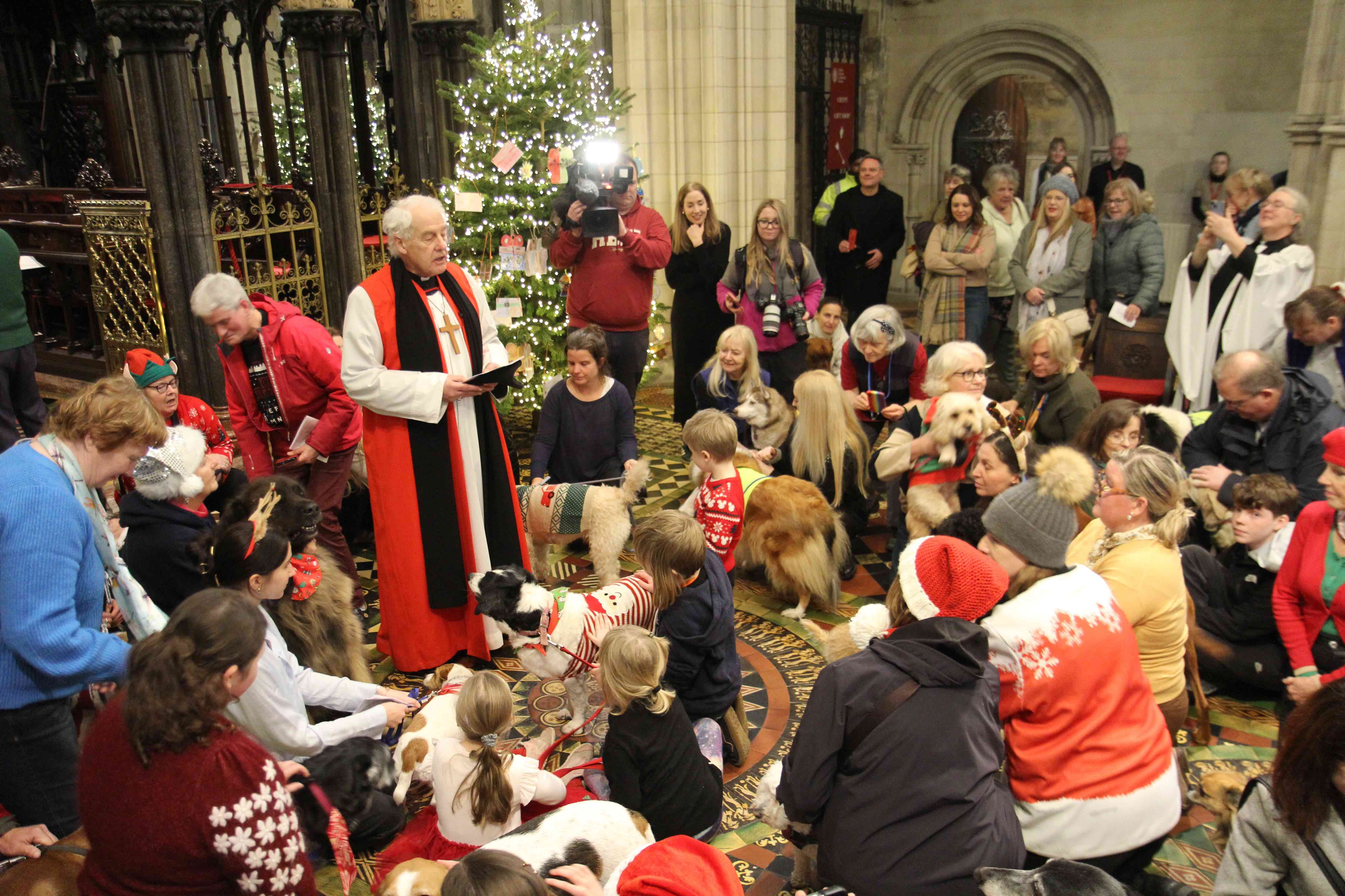 Archbishop Michael Jackson blesses the dogs.