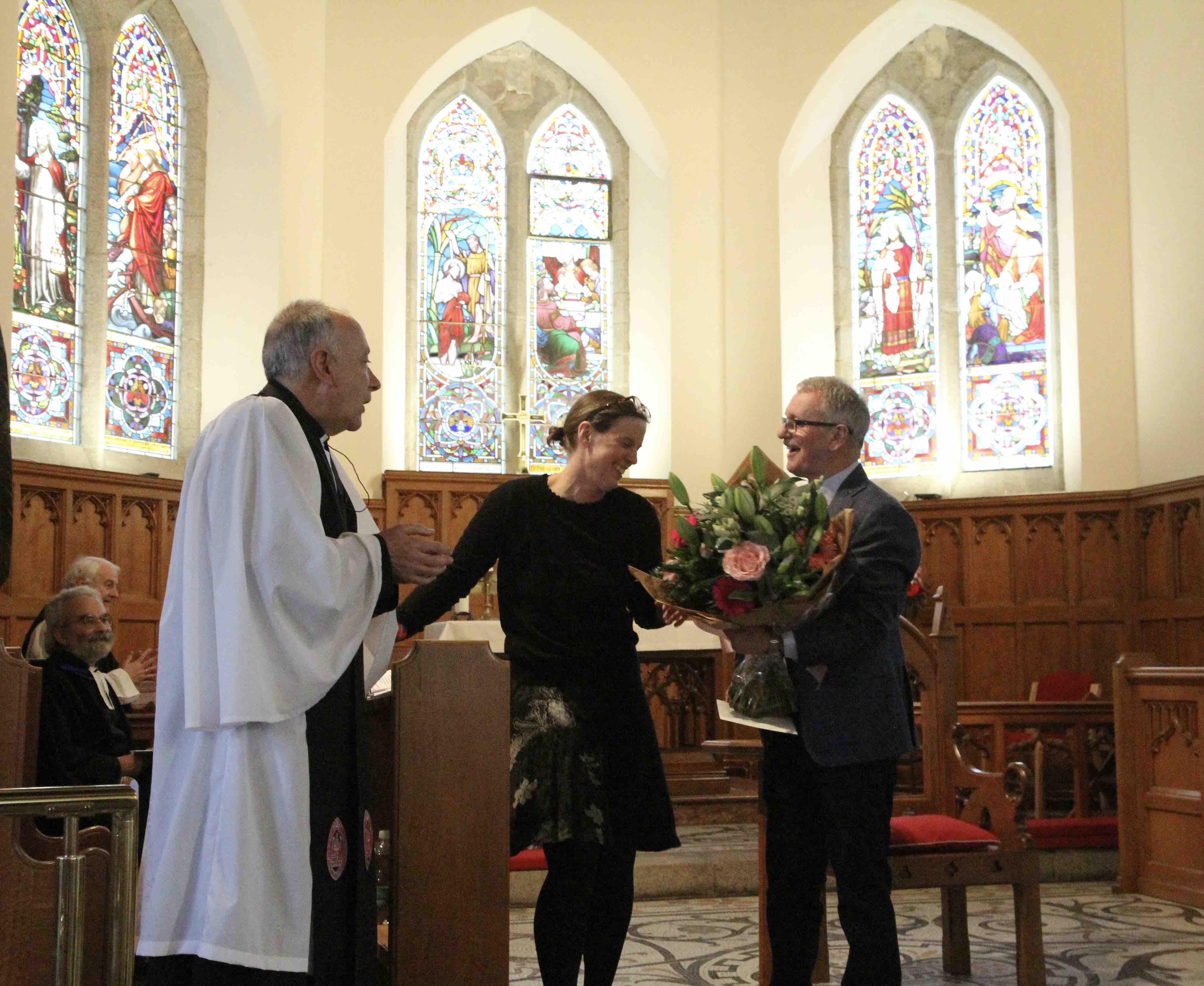 Nicky Bell is presented with flowers to honour her work on the project.