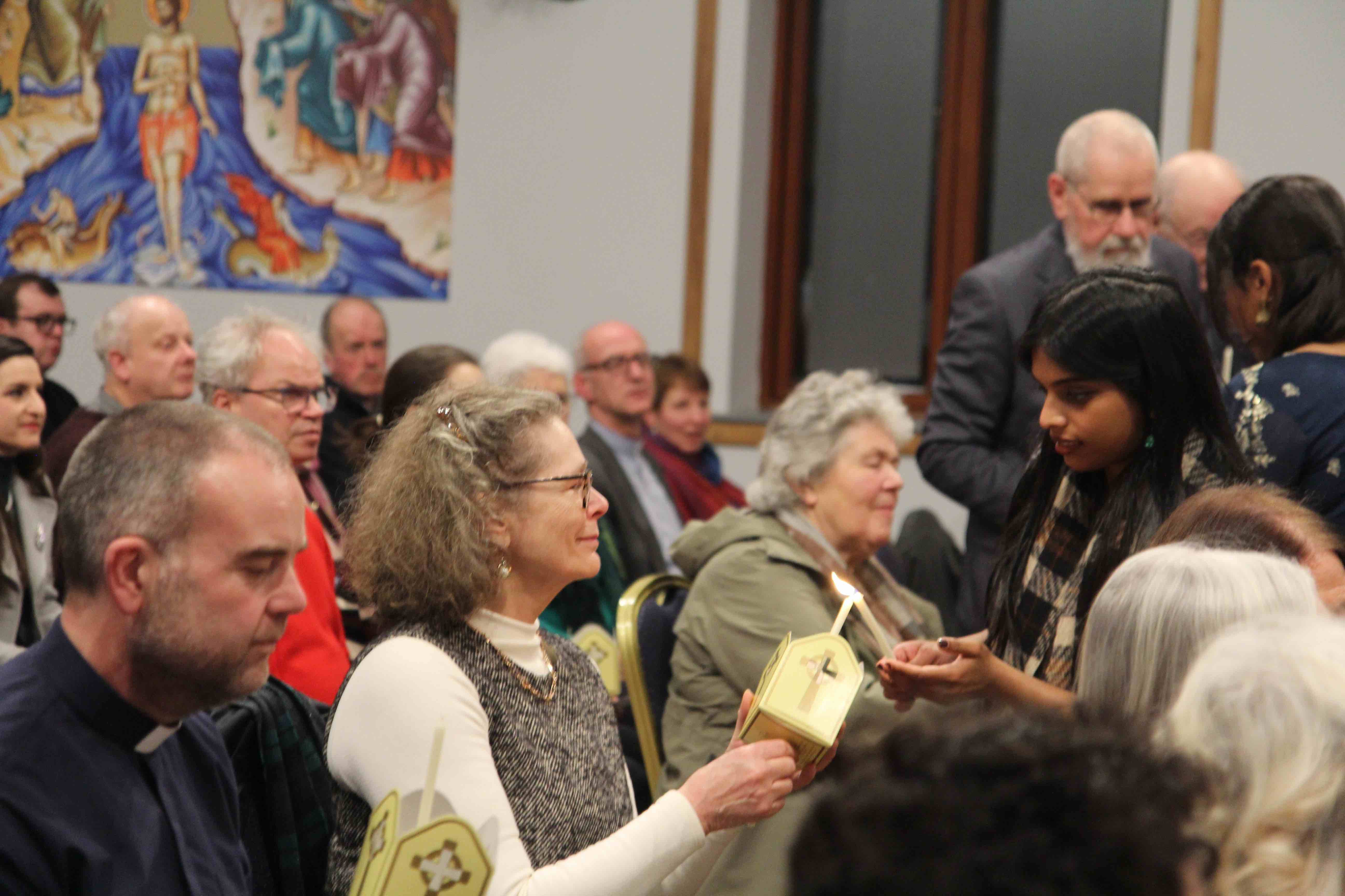 Candles were lit during the service.