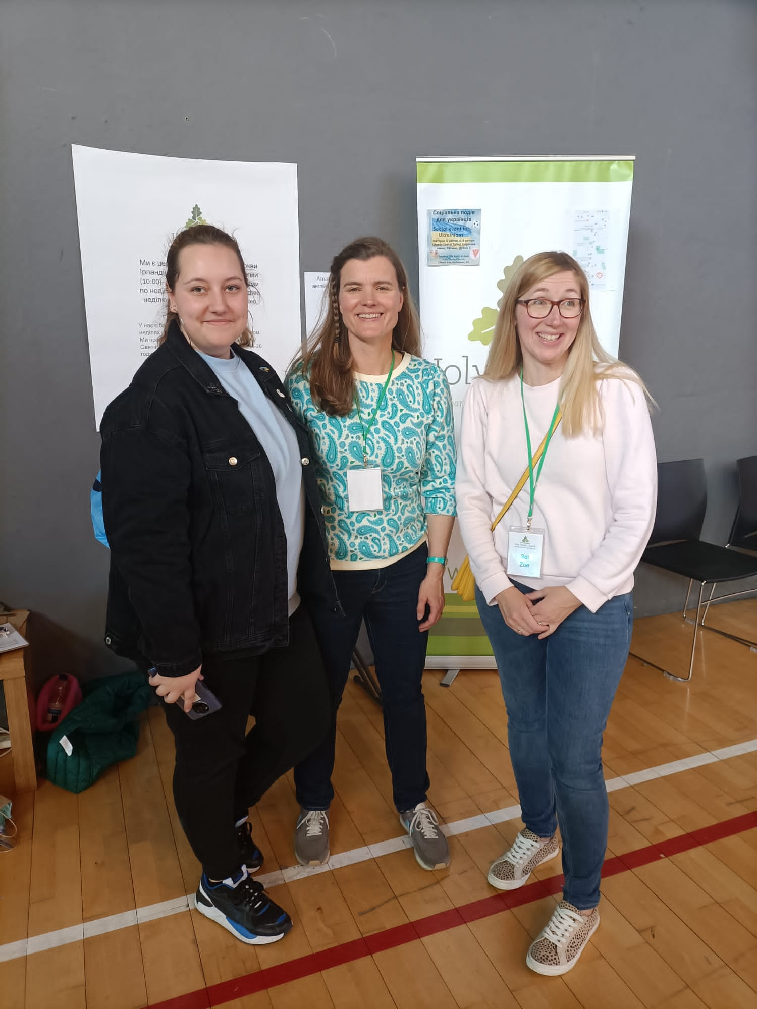 Masha from Ukrain, Chloe and Zoe from Holy Trinity at the church's stand in the Swan Leisure Centre.