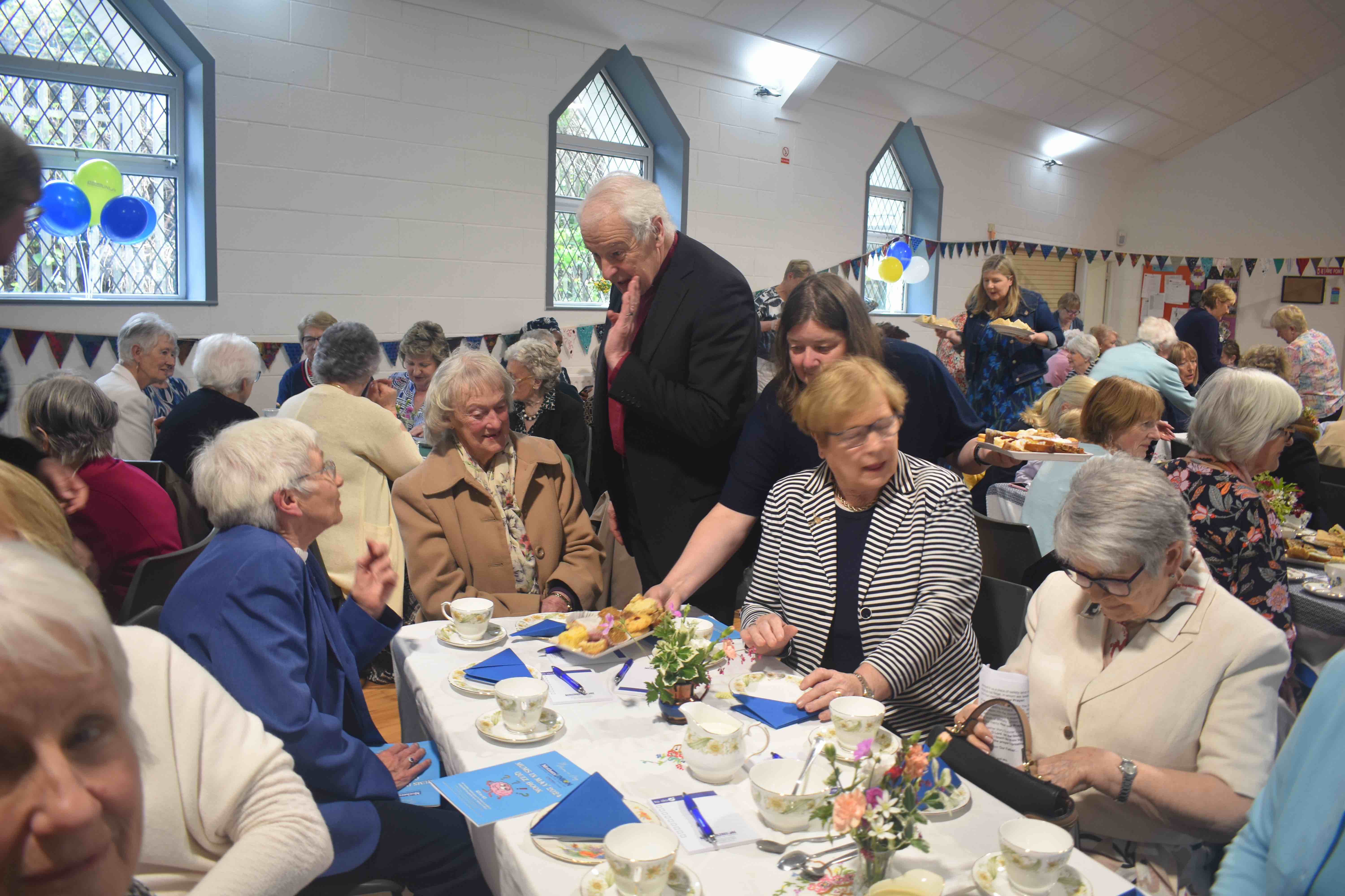 Archbishop Michael Jackson enjoying the MU Tea Party.