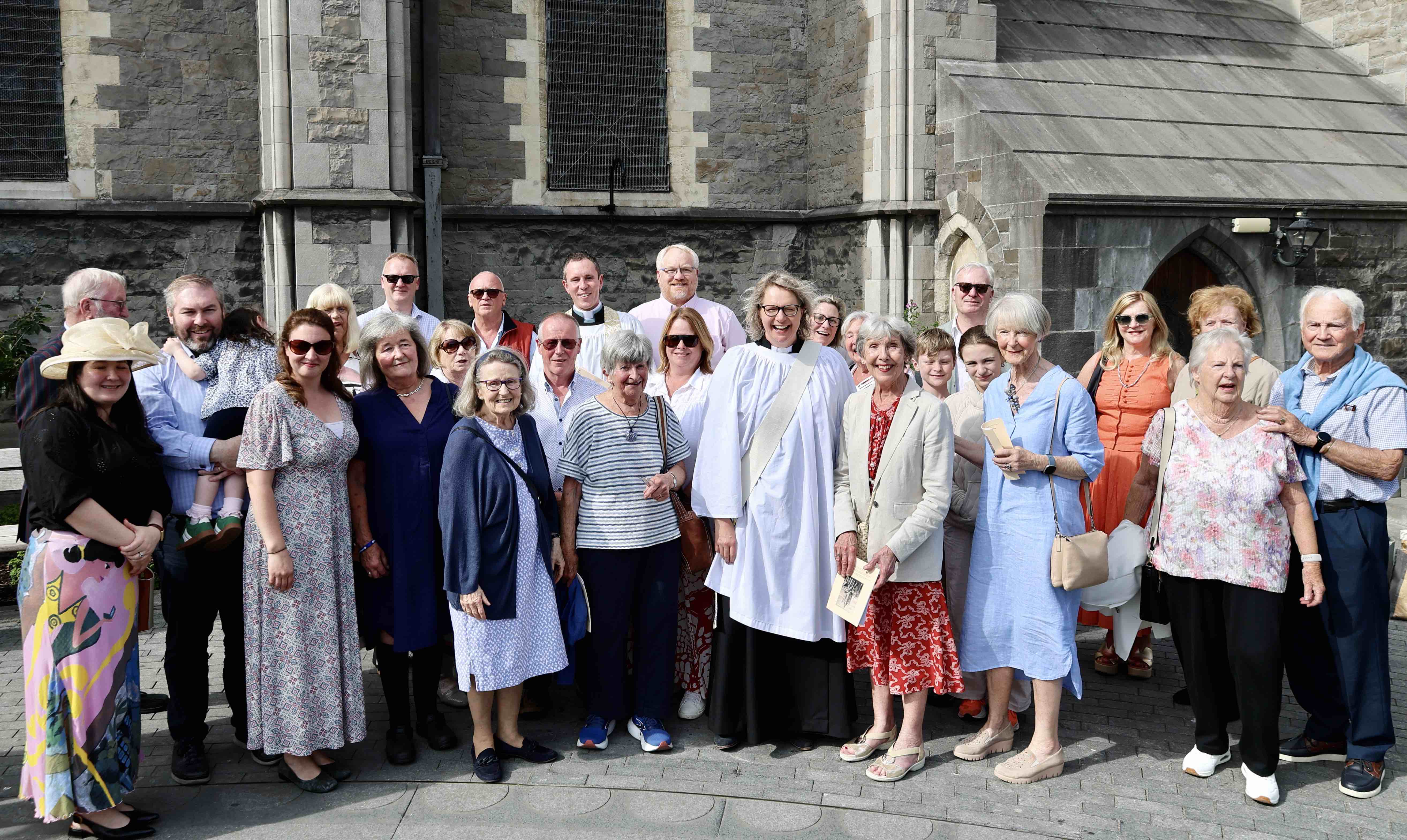 The Revd Esther Simpson with the Revd Sean Hanily and a group of Rathmichael Parishioners.