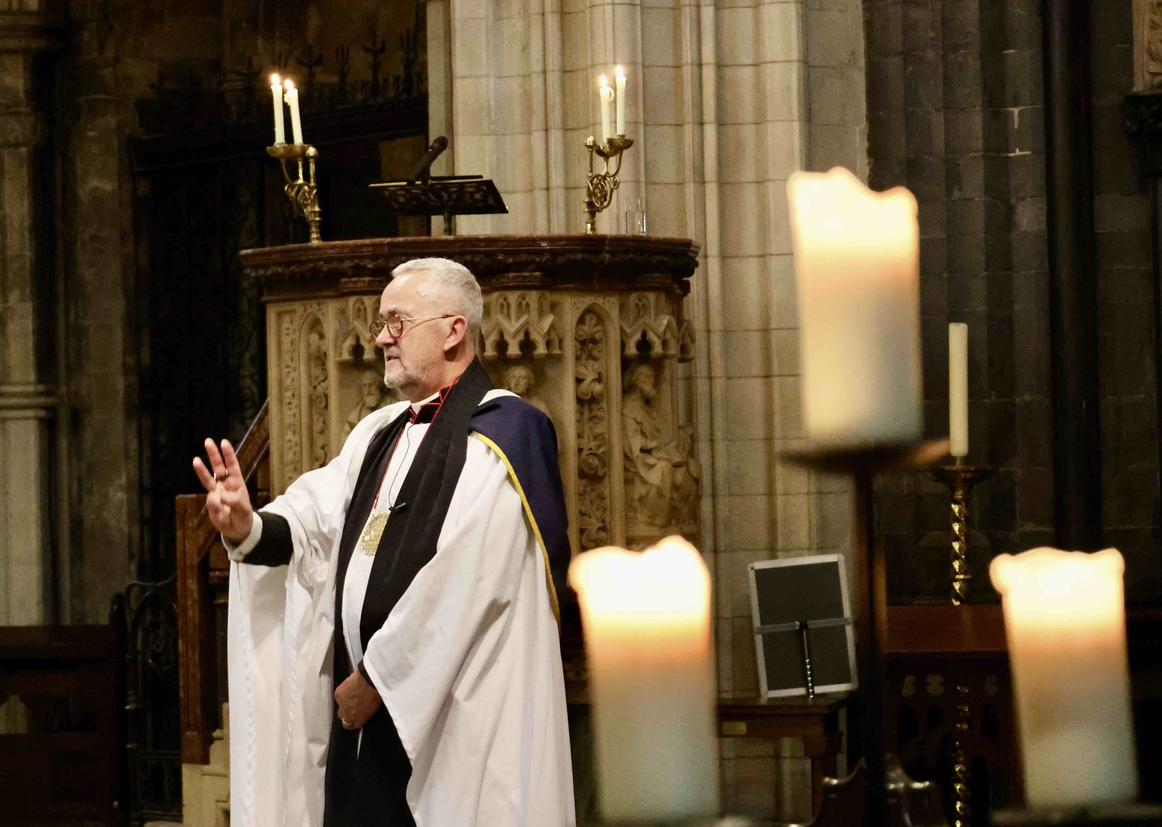 The Dean delivers the blessing.