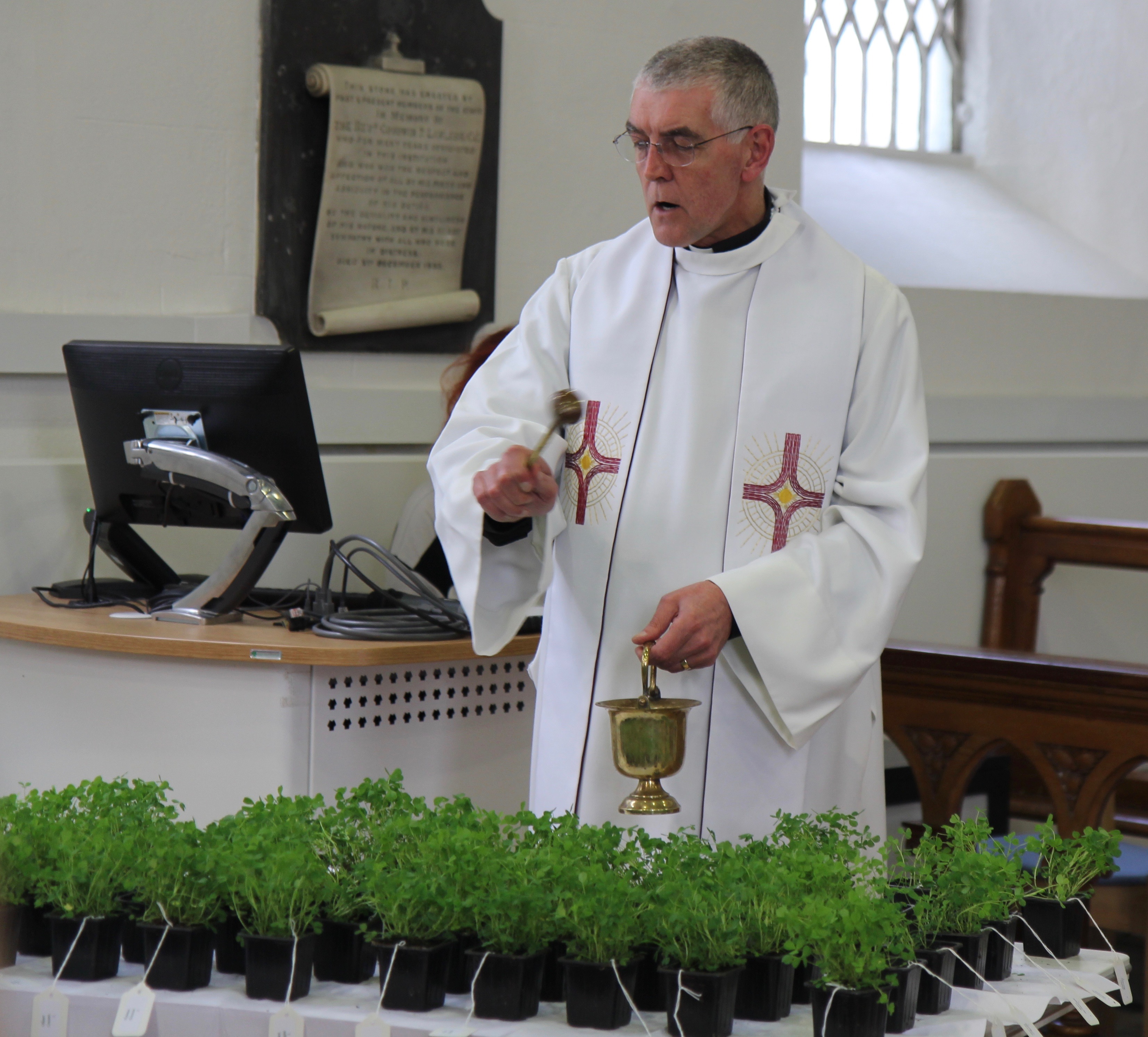 Archdeacon David Pierpoint blesses the shamrock during a service at DIT Grangegorman.