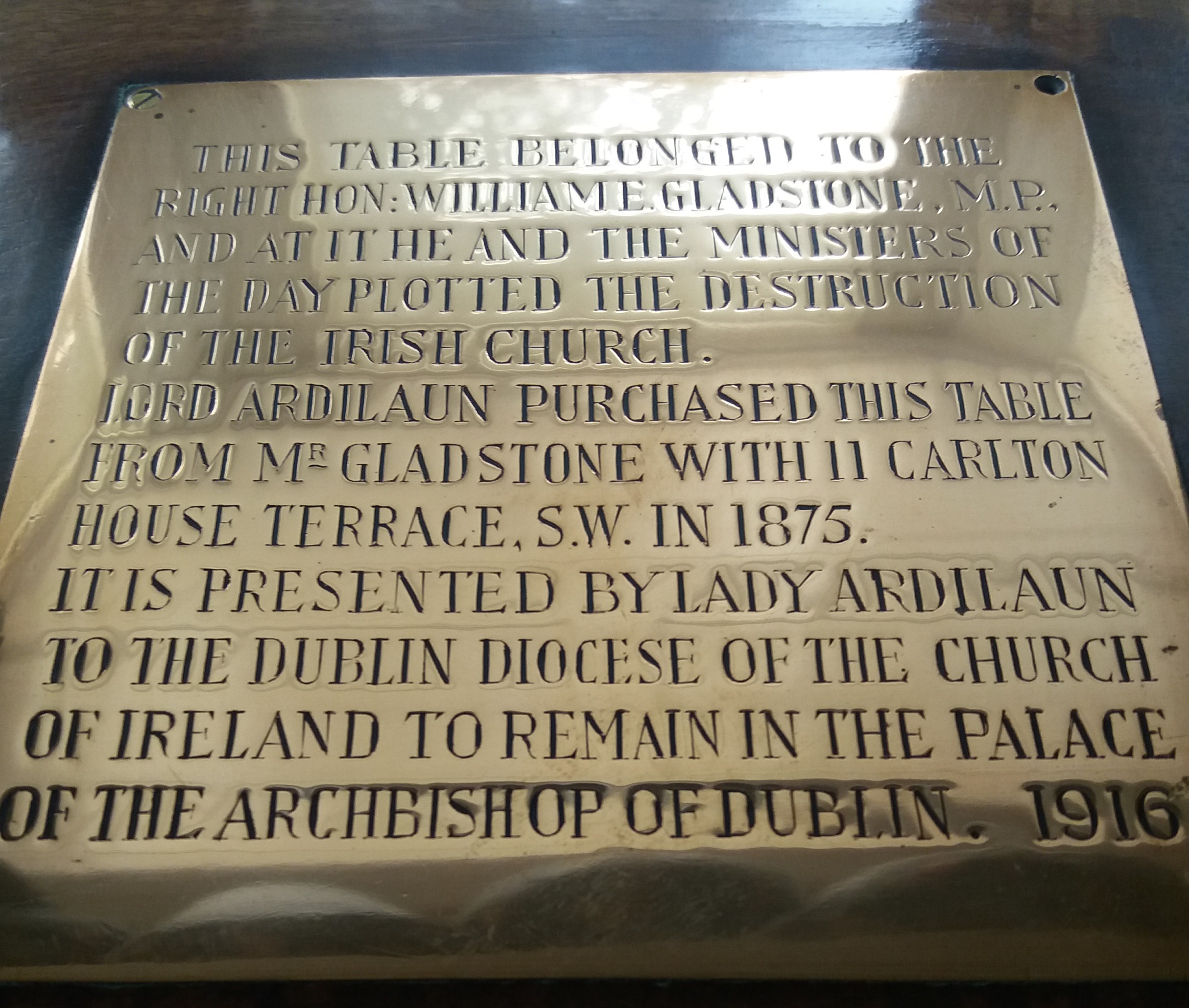 The plaque on the table on which Gladstone is said to have written the Irish Church Act.