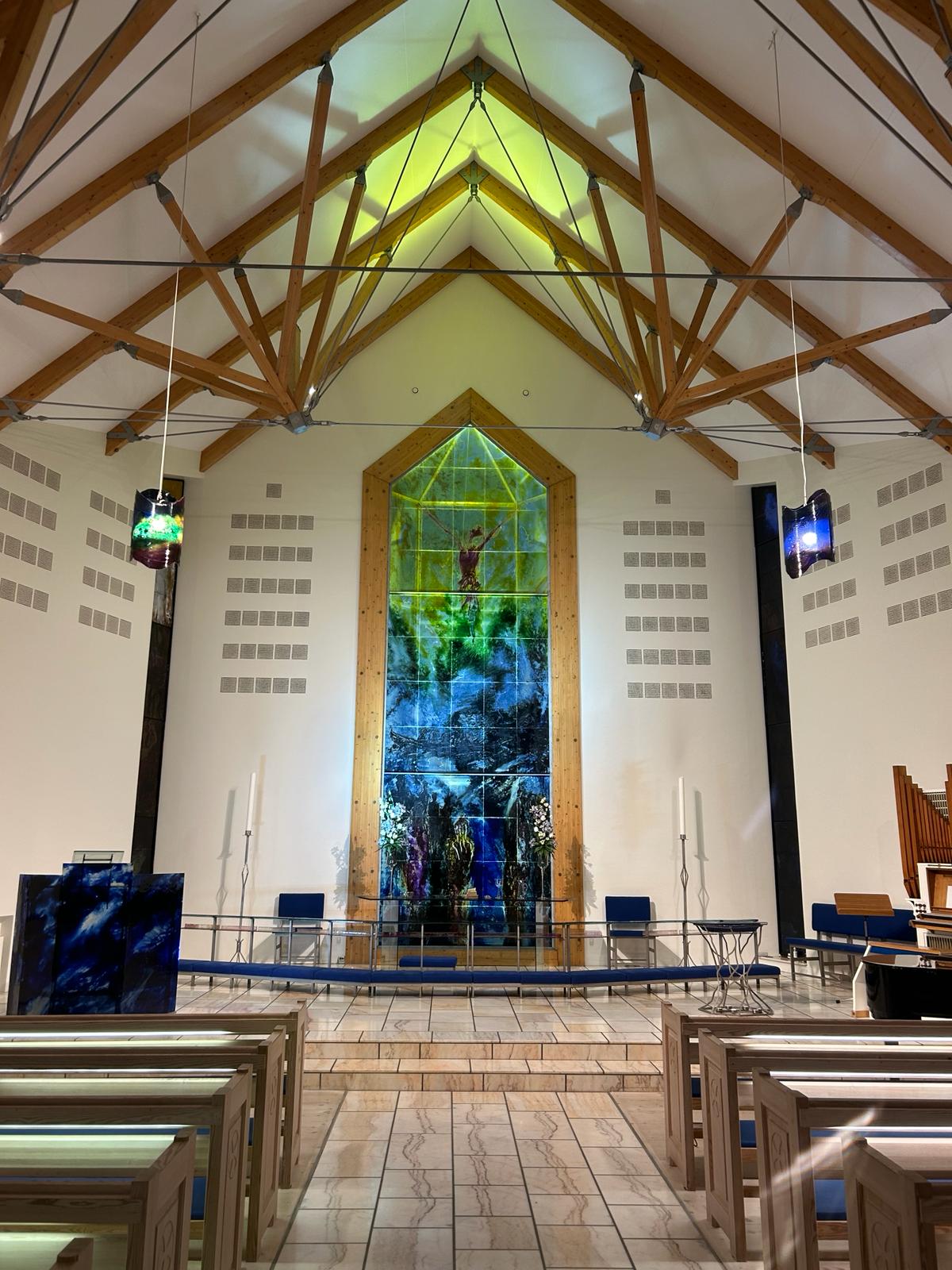 The East window of a local church depicting Good Friday and Easter Day.