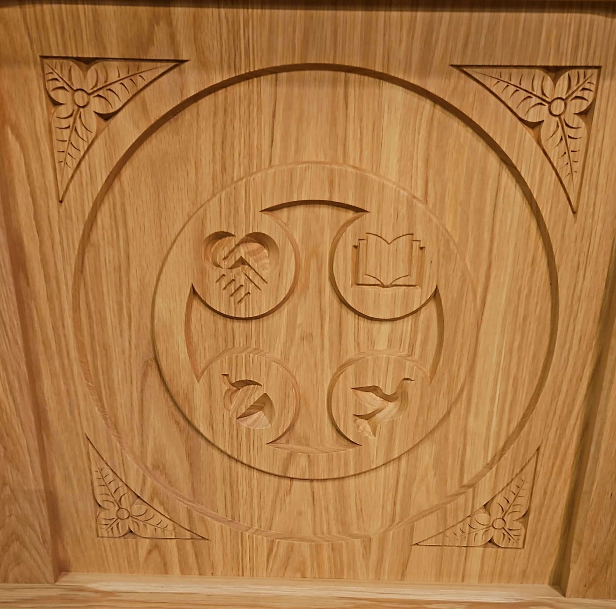 The Parish Logo is carved into the Communion Table.