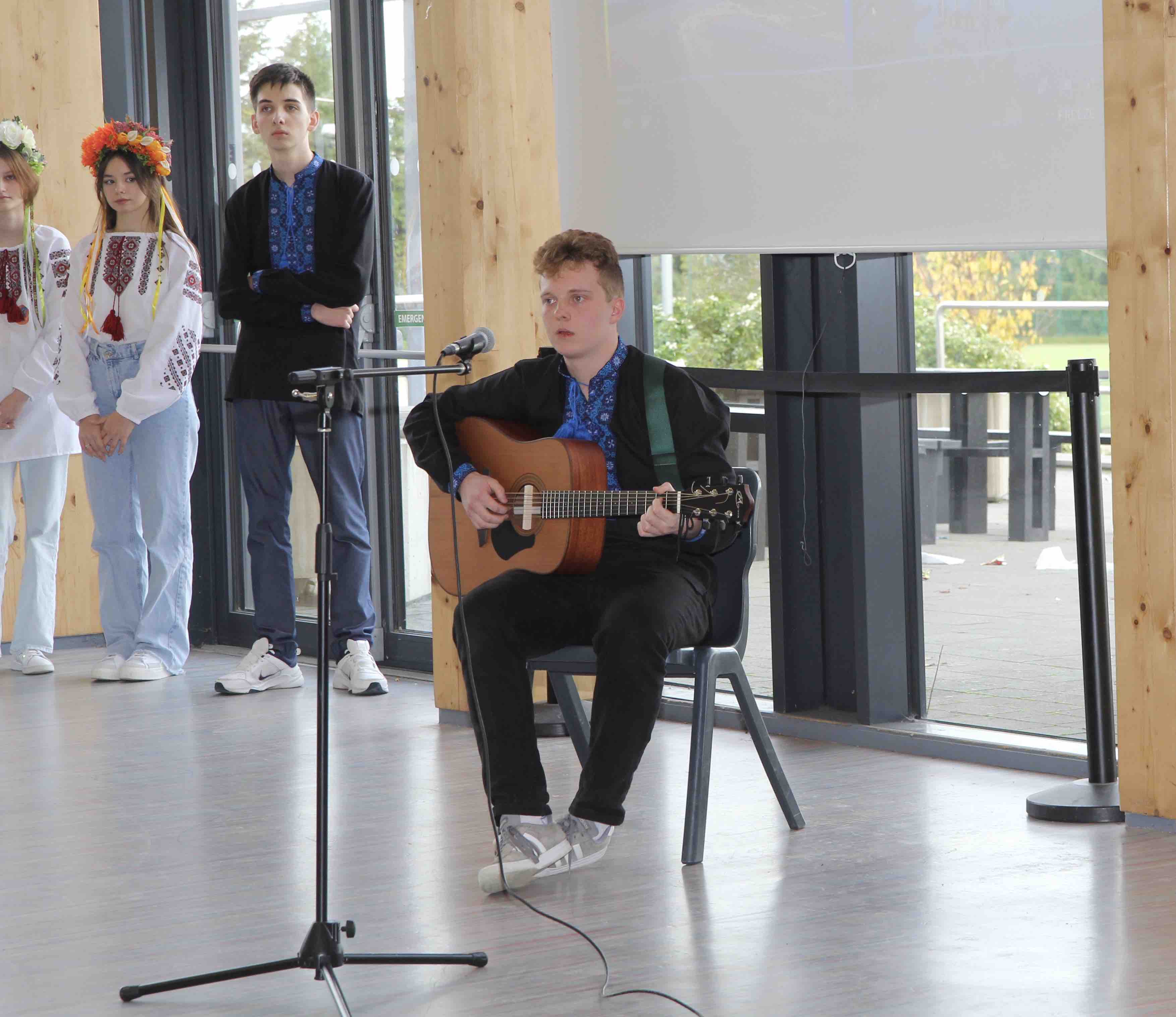 Playing and singing a Ukrainian song.