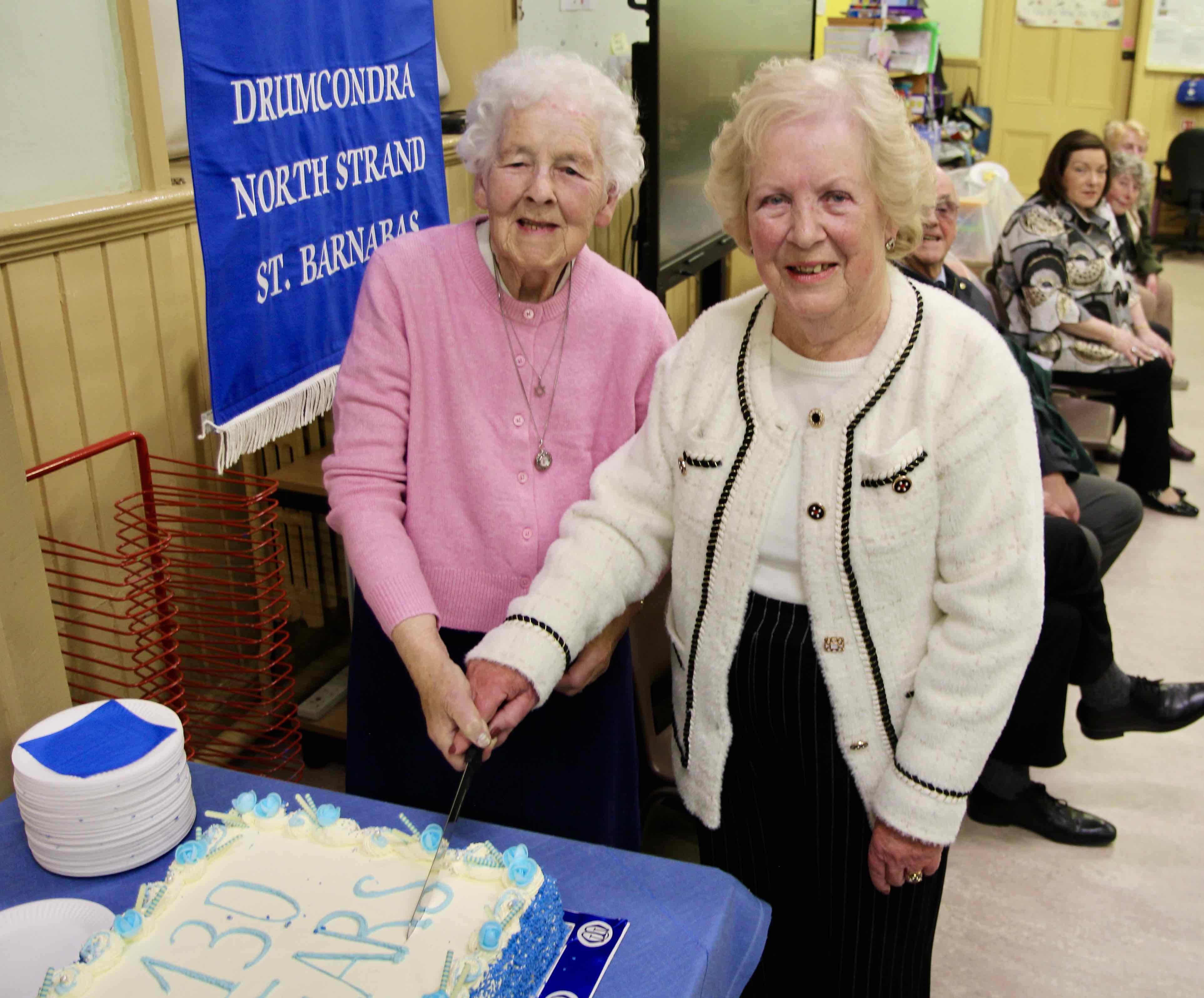 Long serving North Strand MU member Jill Holmes and Anne Mercer cut the cake marking the 130th anniversary of MU in the parish.