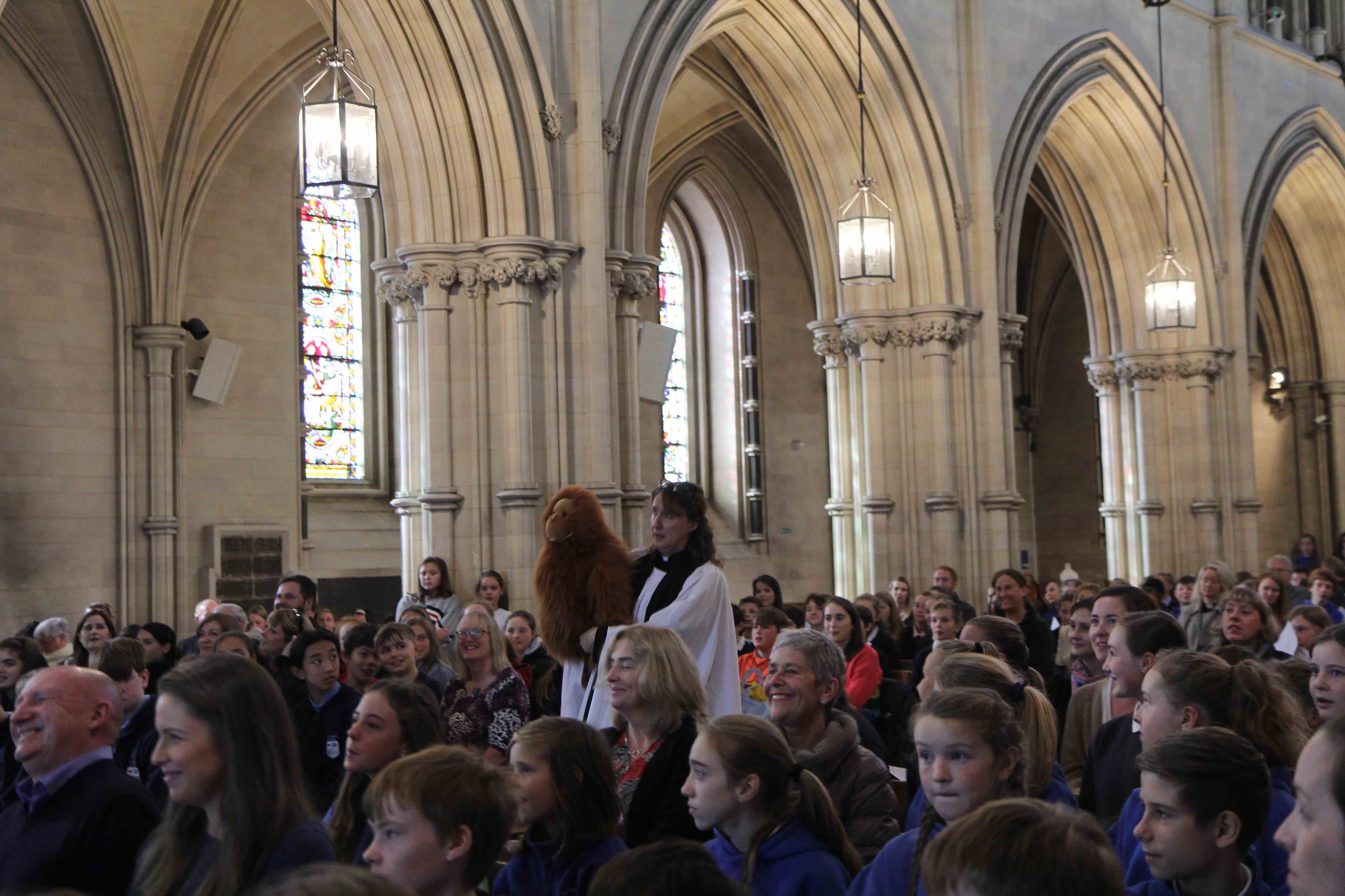 The Revd Cathy Hallissey and Copperpot amongst the pupils at the Diocesan Schools Service